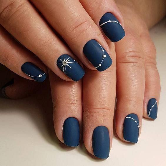 Dark blue winter nails with shooting star